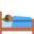 person in bed, medium-dark skin tone